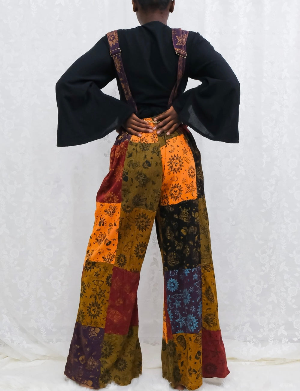 back of celestial patchwork overalls