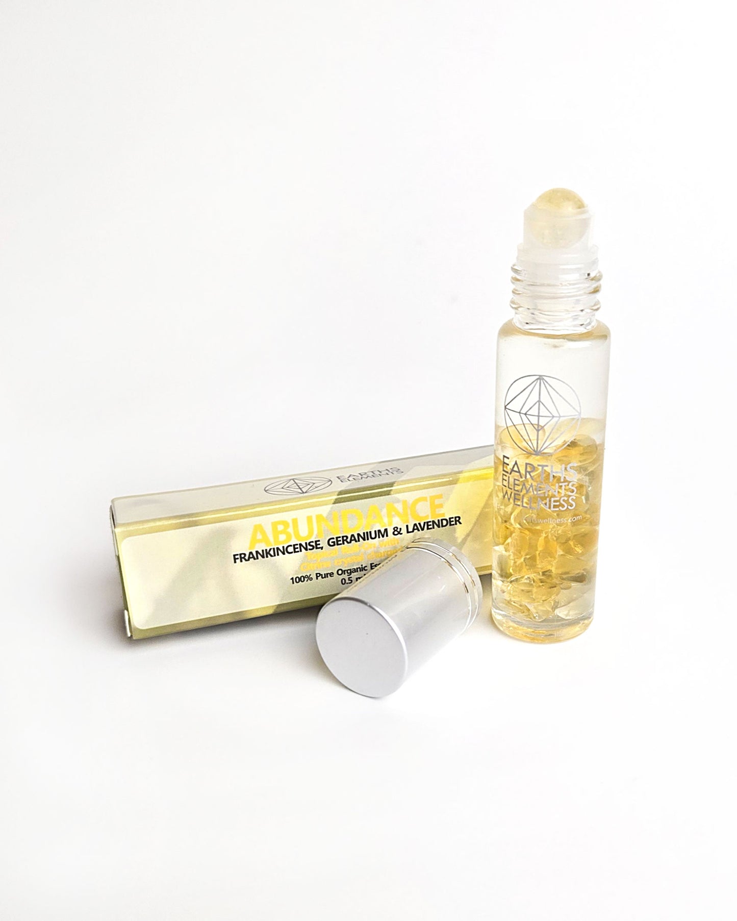 organic essential oil blend roll on of frankincense geranium and lavender in a roll on with citrine crystals showing citrine roller ball
