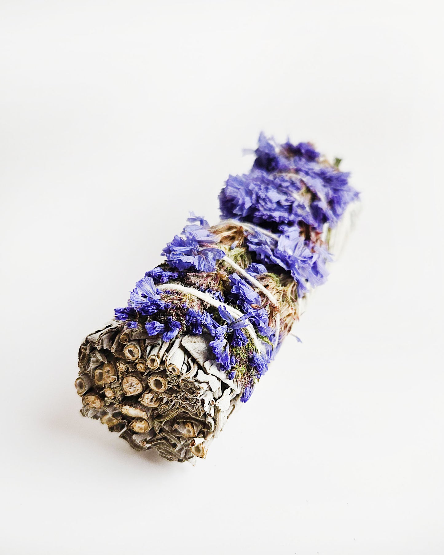 sage smudge stick with blue sinuata flowers for smudging and cleansing