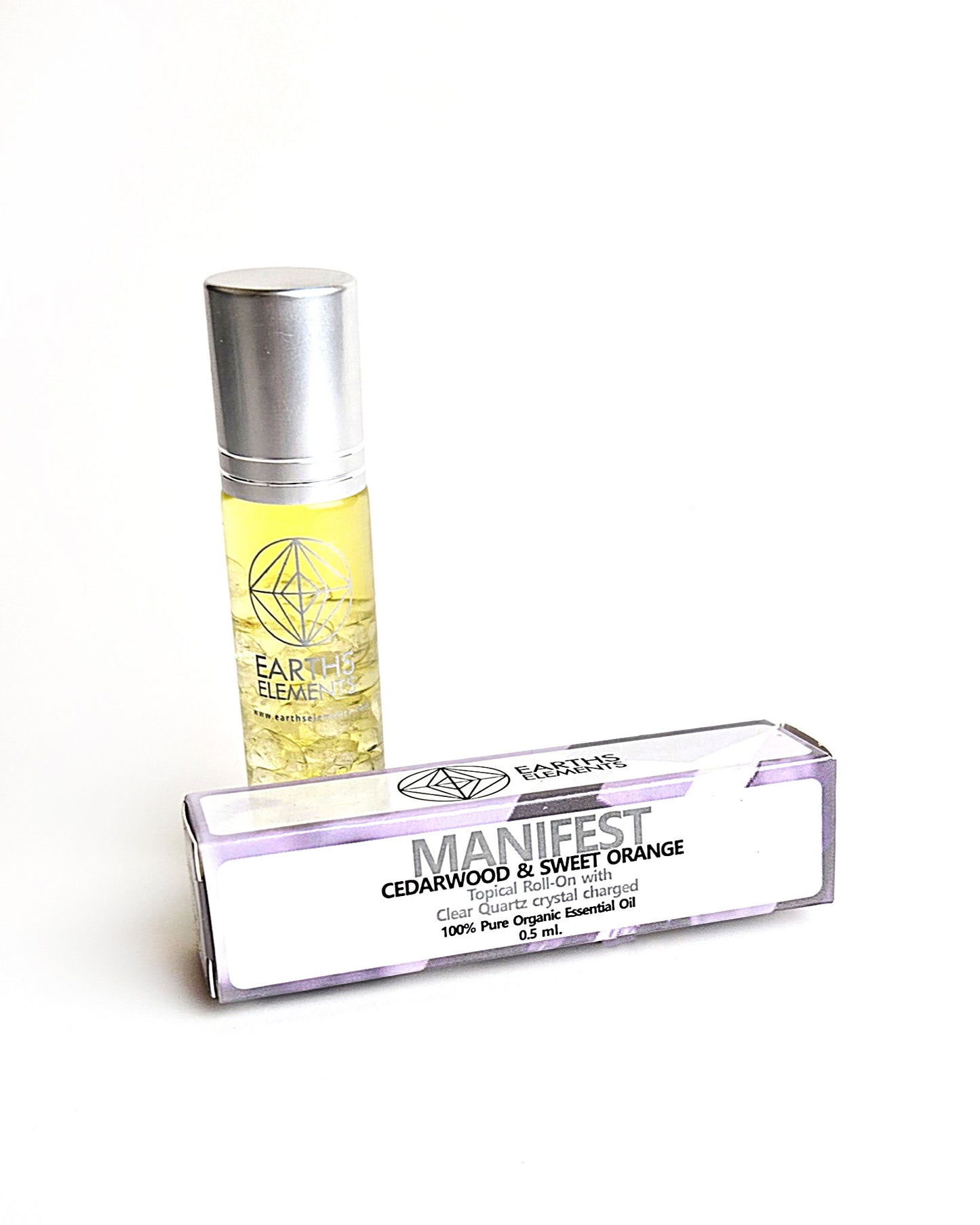 organic essential oil blend roll on of cedarwood and sweet orange with clear quartz crystals