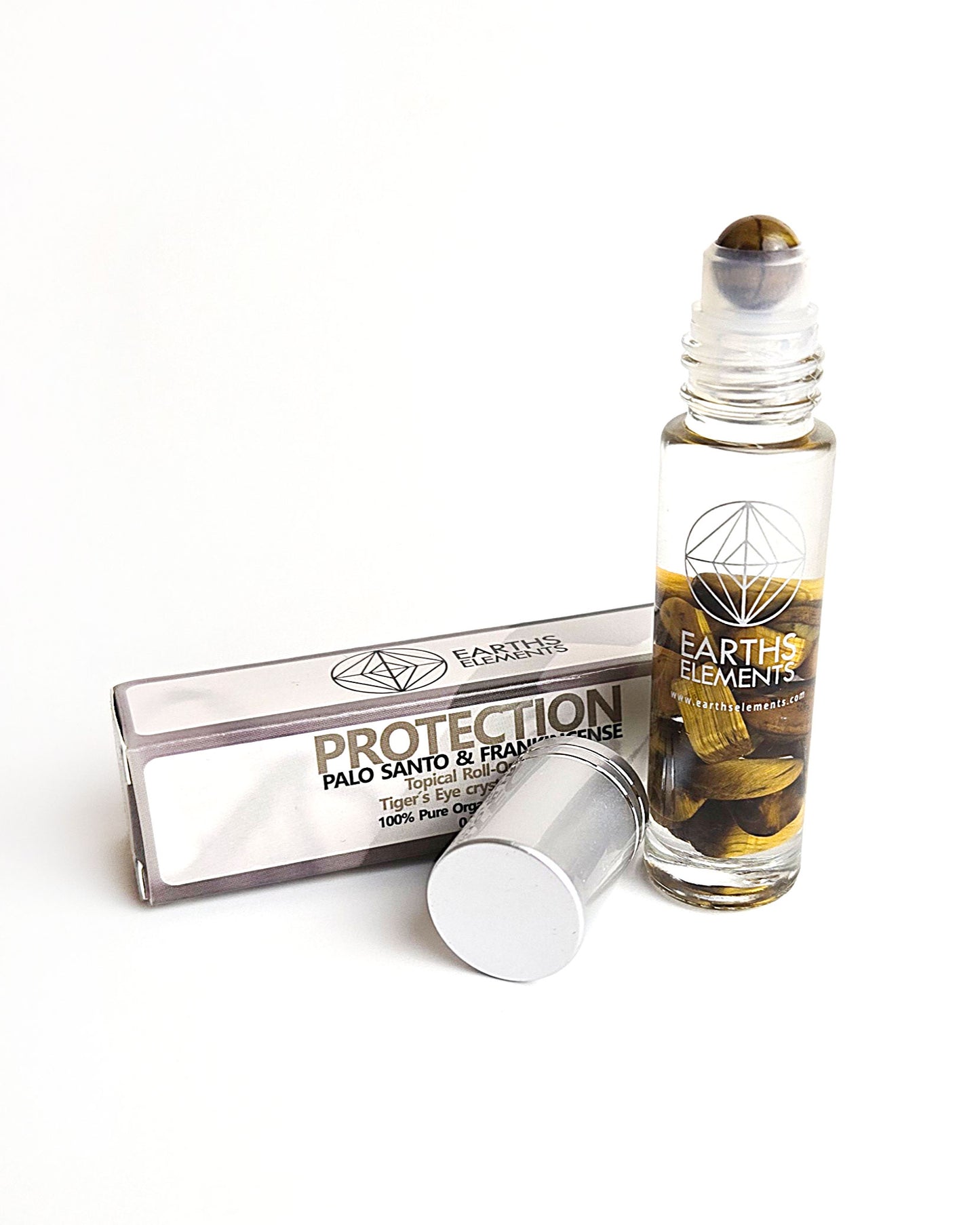 organic essential oil blend roll on of Palo Santo and frankincense with tigers eye crystals showing tigers eye roller ball