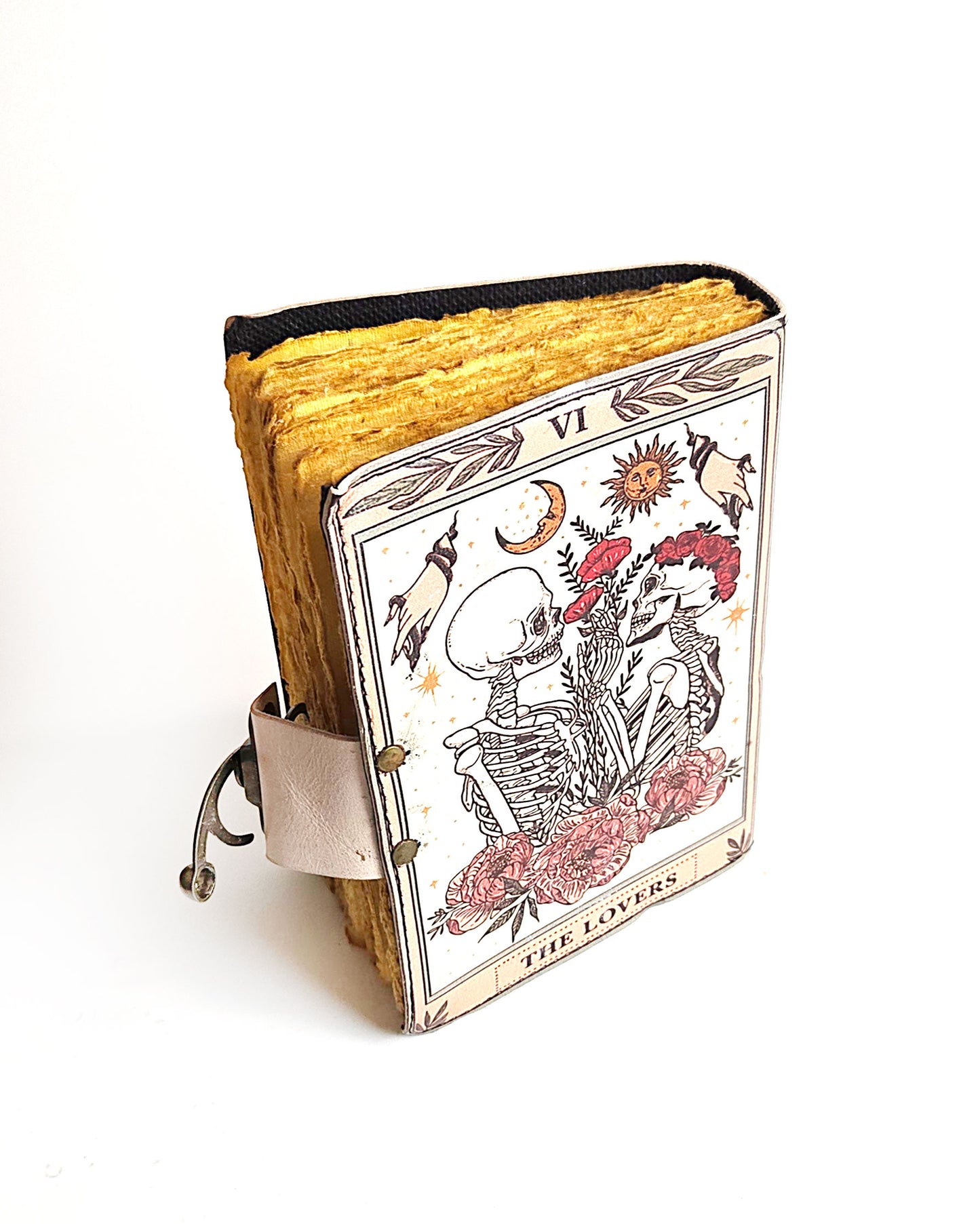 leather journal with the lovers tarot card design antique buckle closure and deckle edge vintage look paper back