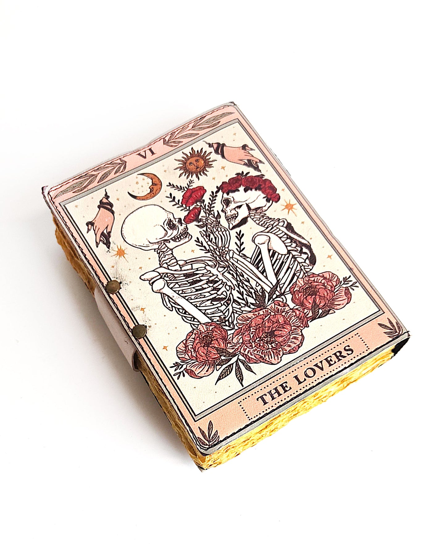 leather journal with the lovers tarot card design antique buckle closure and deckle edge vintage look paper back