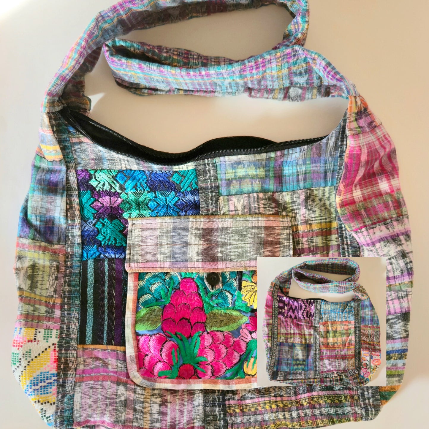 Colorful patchwork upcycled hobo bag with floral design on a beige background