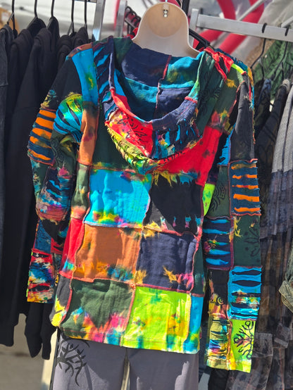Colorful tie-dye jacket on a mannequin against a clothing store background