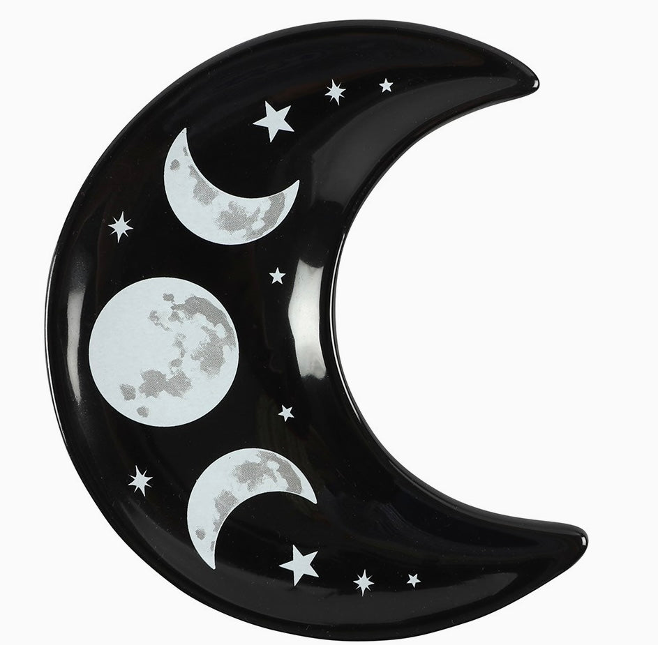 black crescent moon shaped trinket dish with moon phases and stars design