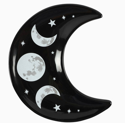 black crescent moon shaped trinket dish with moon phases and stars design