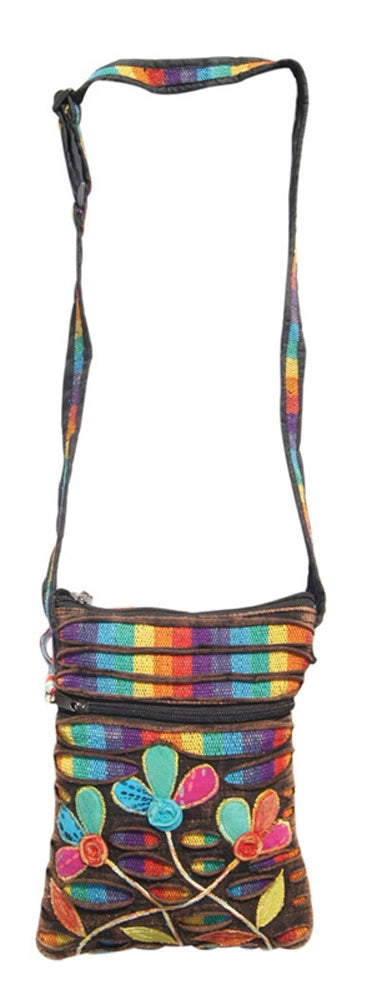 A multicolored shoulder bag with a floral pattern and a striped design, featuring a long strap.