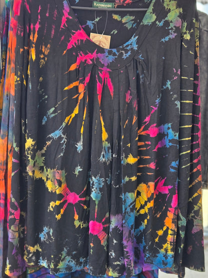 Colorful tie-dye shirt on a hanger.