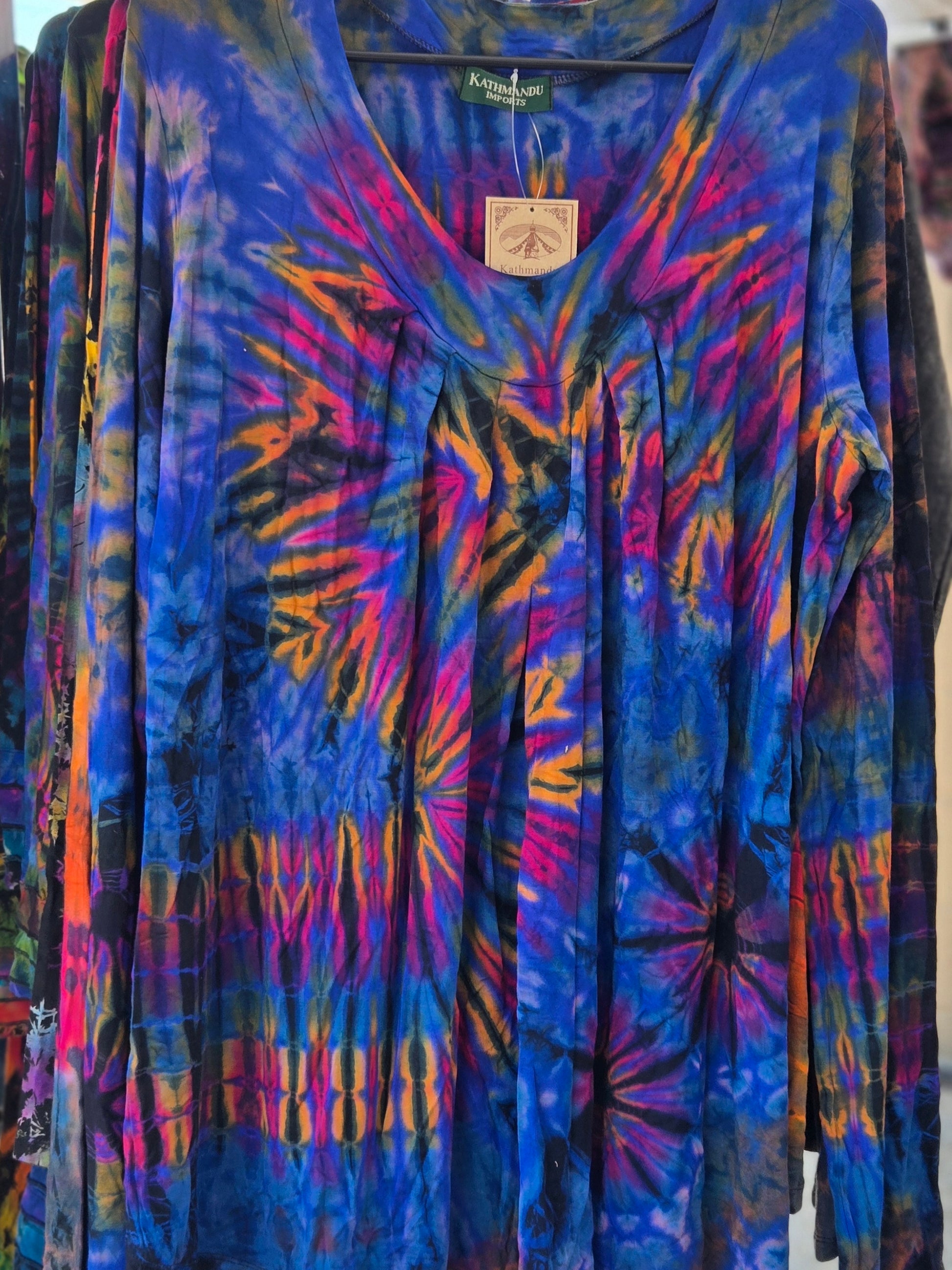 Colorful tie-dye shirt on a hanger