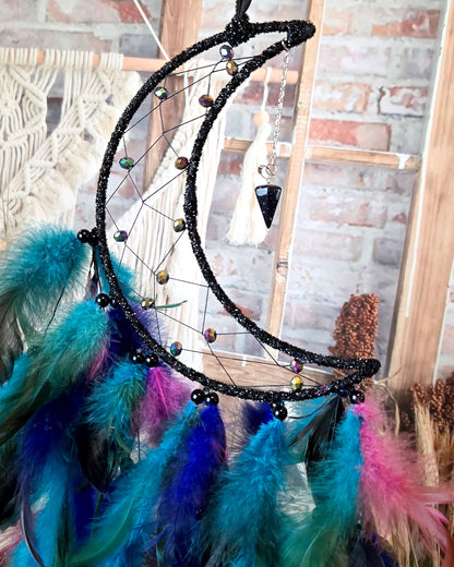 hippie home décor black and blue crescent moon dream catcher with feathers close up