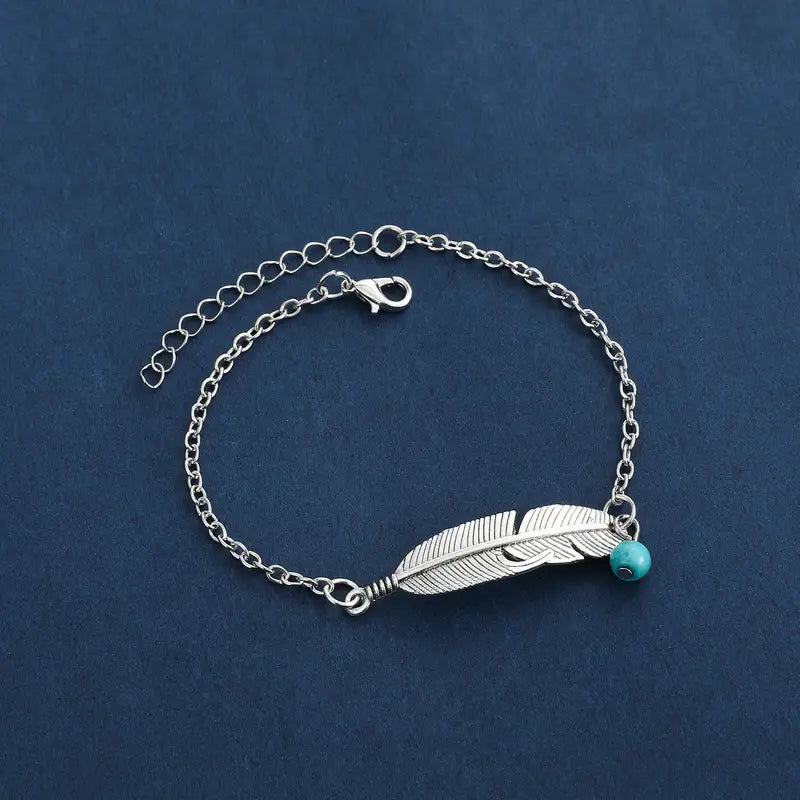 silver color feather anklet with turquoise bead