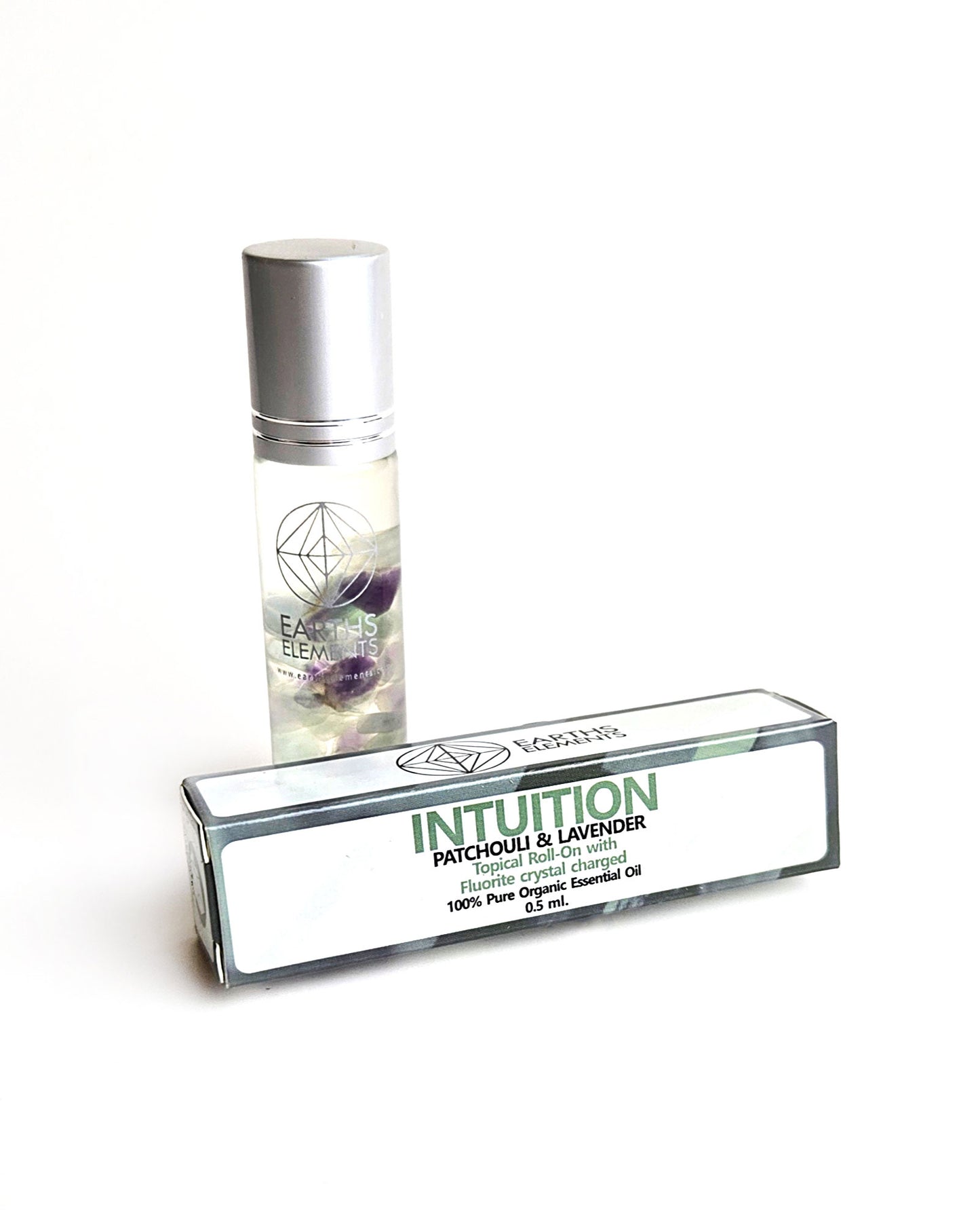 organic essential oil blend roll on of patchouli and lavender with fluorite crystals