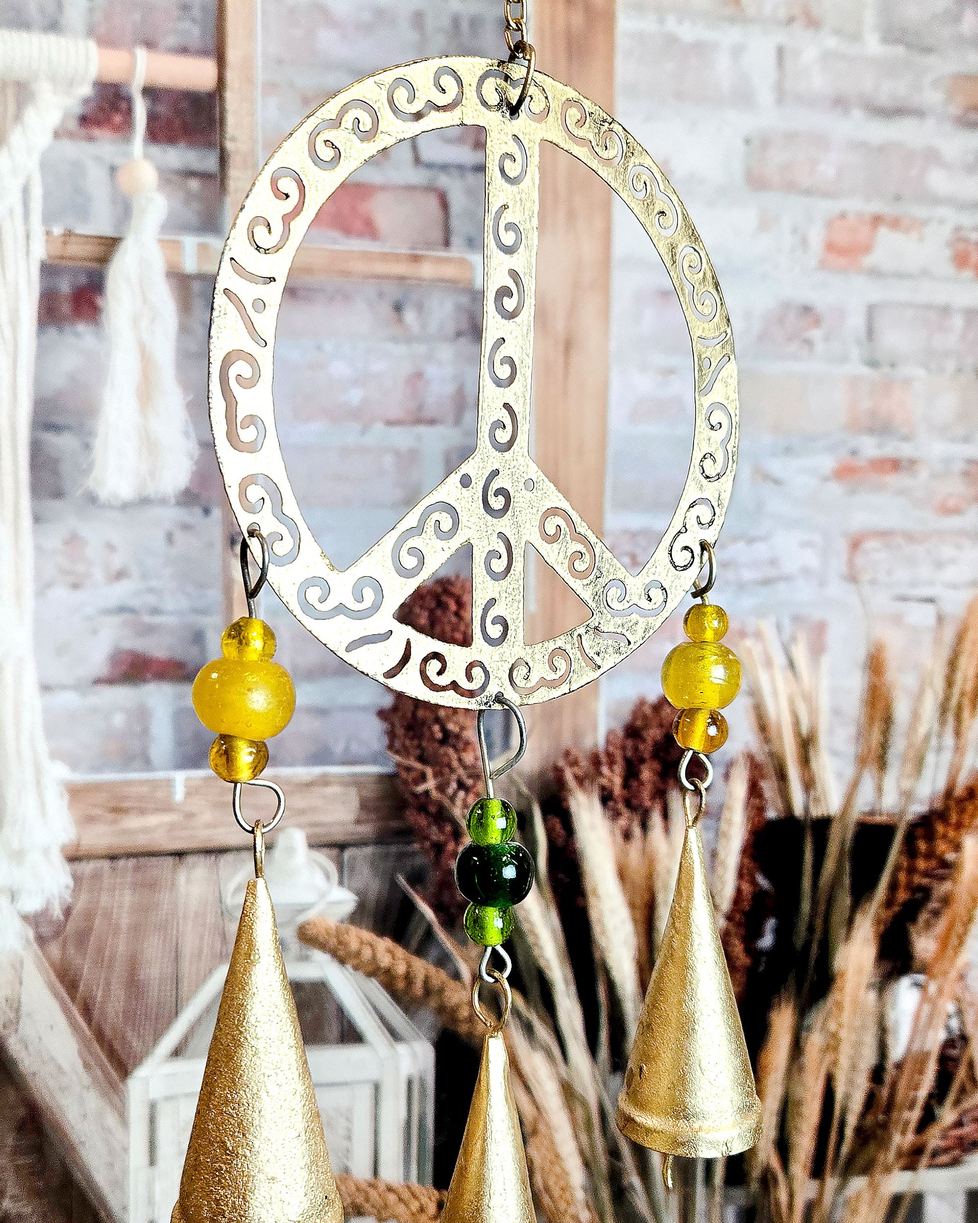 close up of peace sign metal wind chime for your boho hippie porch or patio décor