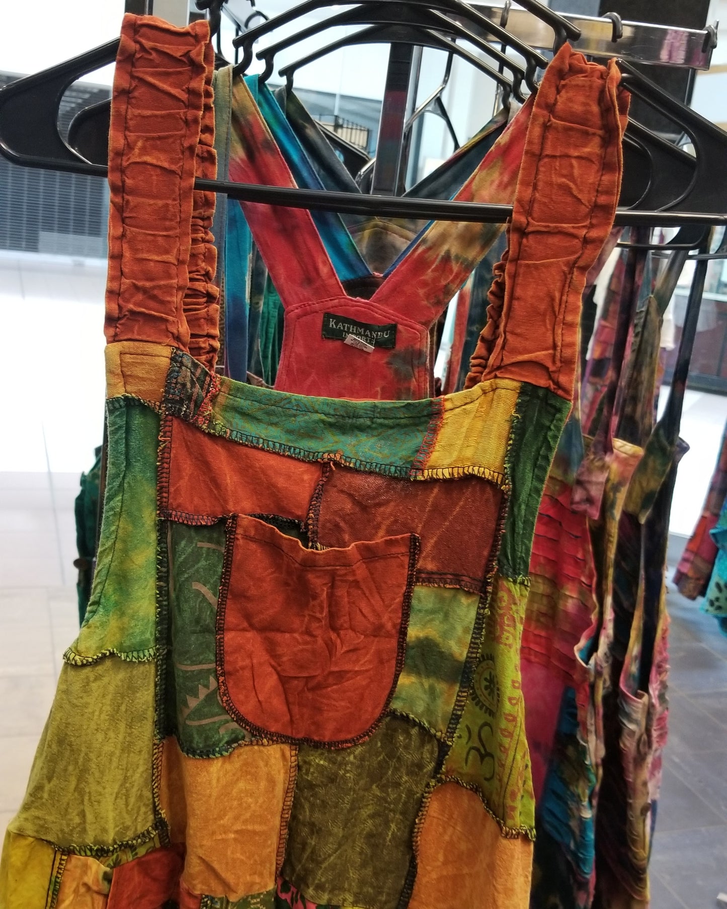 orange wide leg patchwork hippie overalls close up