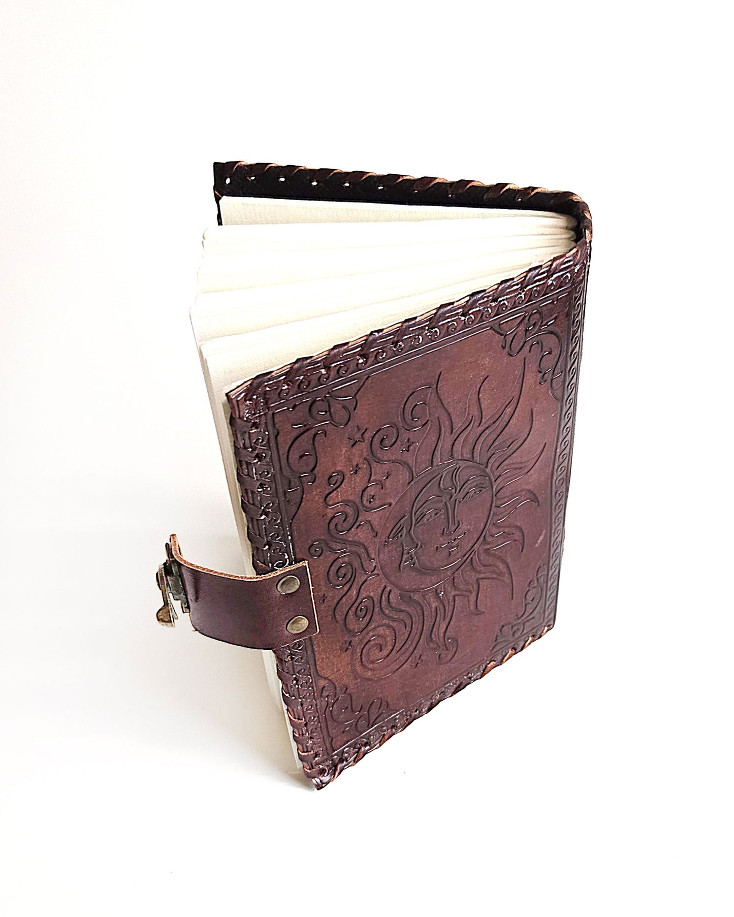 leather journal with embossed sun and moon design antique buckle closure and leather stitched edges top back
