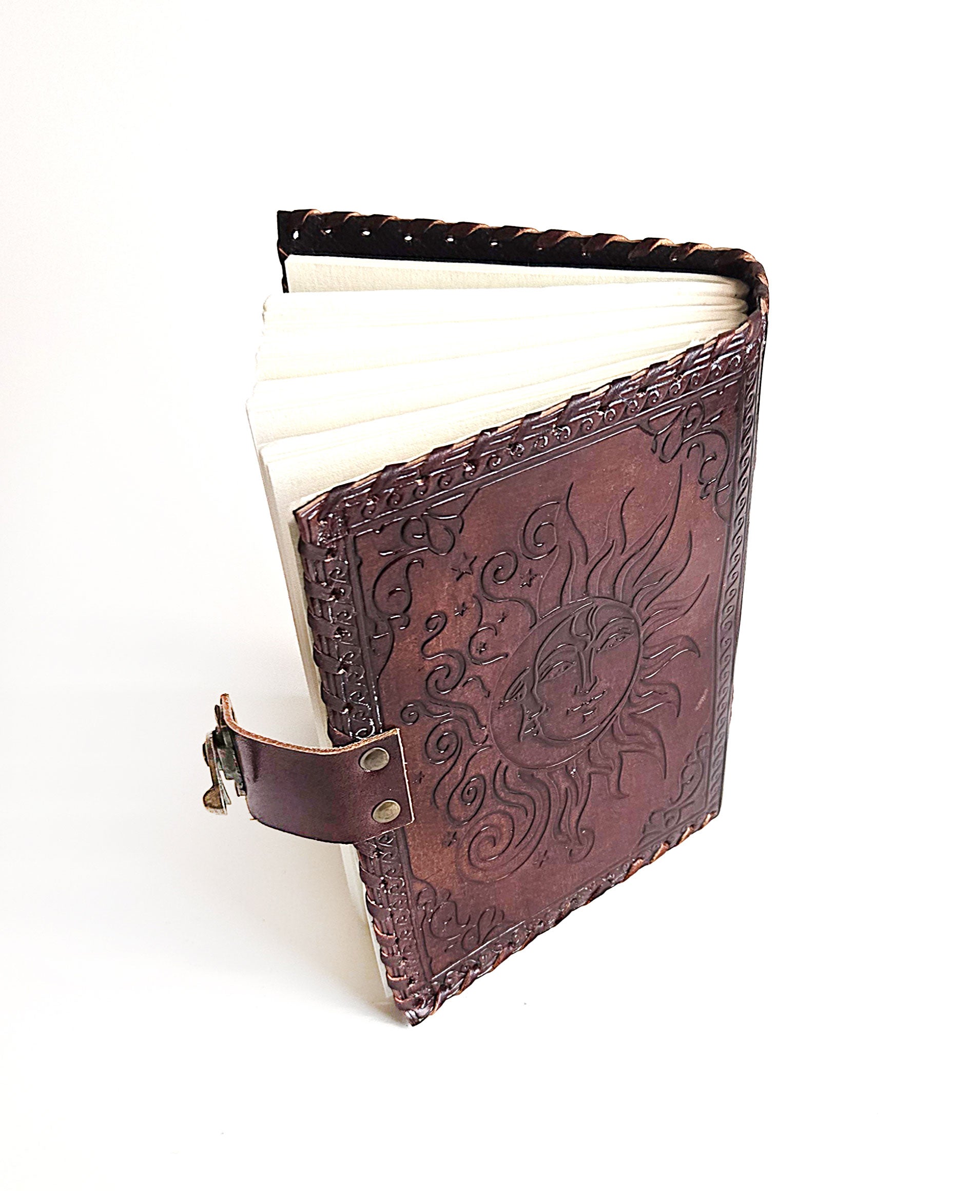leather journal with embossed sun and moon design antique buckle closure and leather stitched edges top back