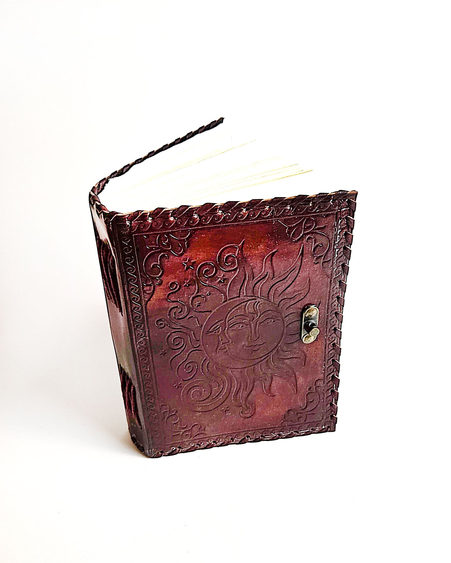 leather journal with embossed sun and moon design antique buckle closure and leather stitched edges top front