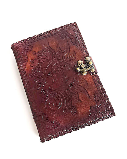 leather writing journal with embossed sun and moon design antique buckle closure and leather stitched edges front