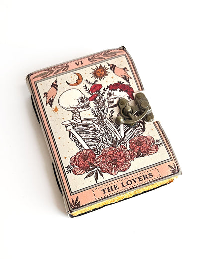 leather journal with the lovers tarot card design antique buckle closure and deckle edge vintage look paper front
