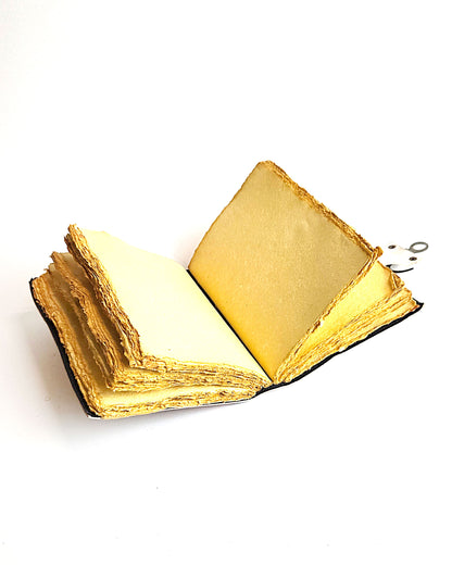 leather journal with the lovers tarot card design antique buckle closure and deckle edge vintage look paper inside view