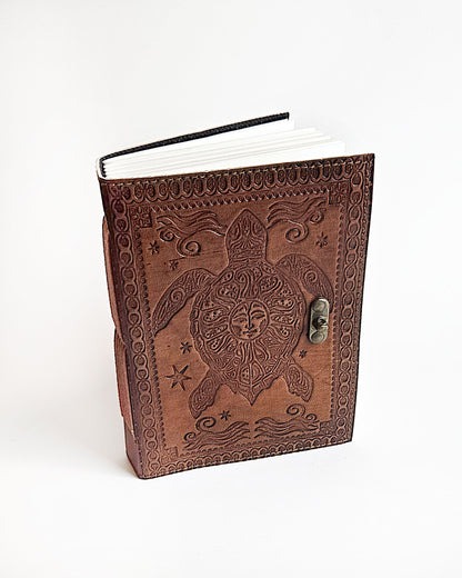 leather journal with embossed turtle design and antique buckle closure top front